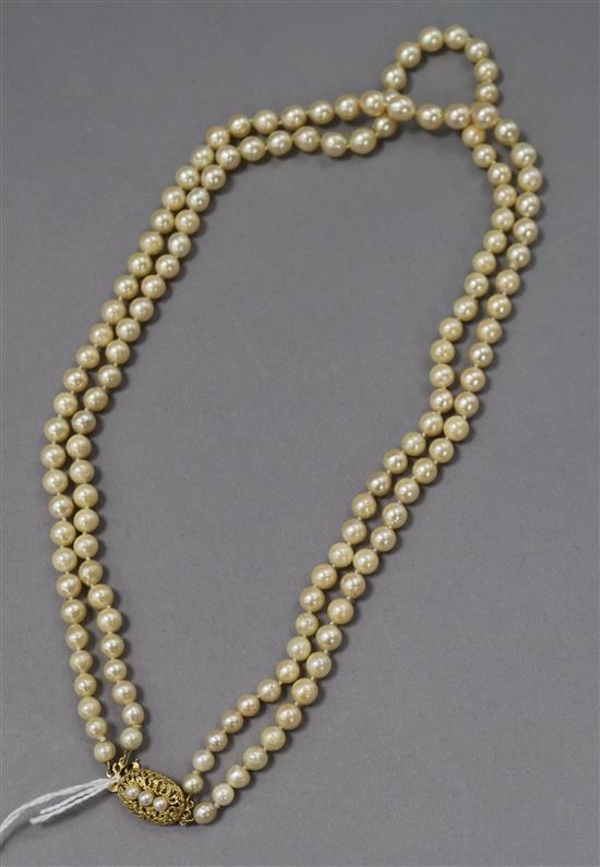 A double strand cultured pearl necklace, with cultured pearl yellow metal clasp, 38cm.